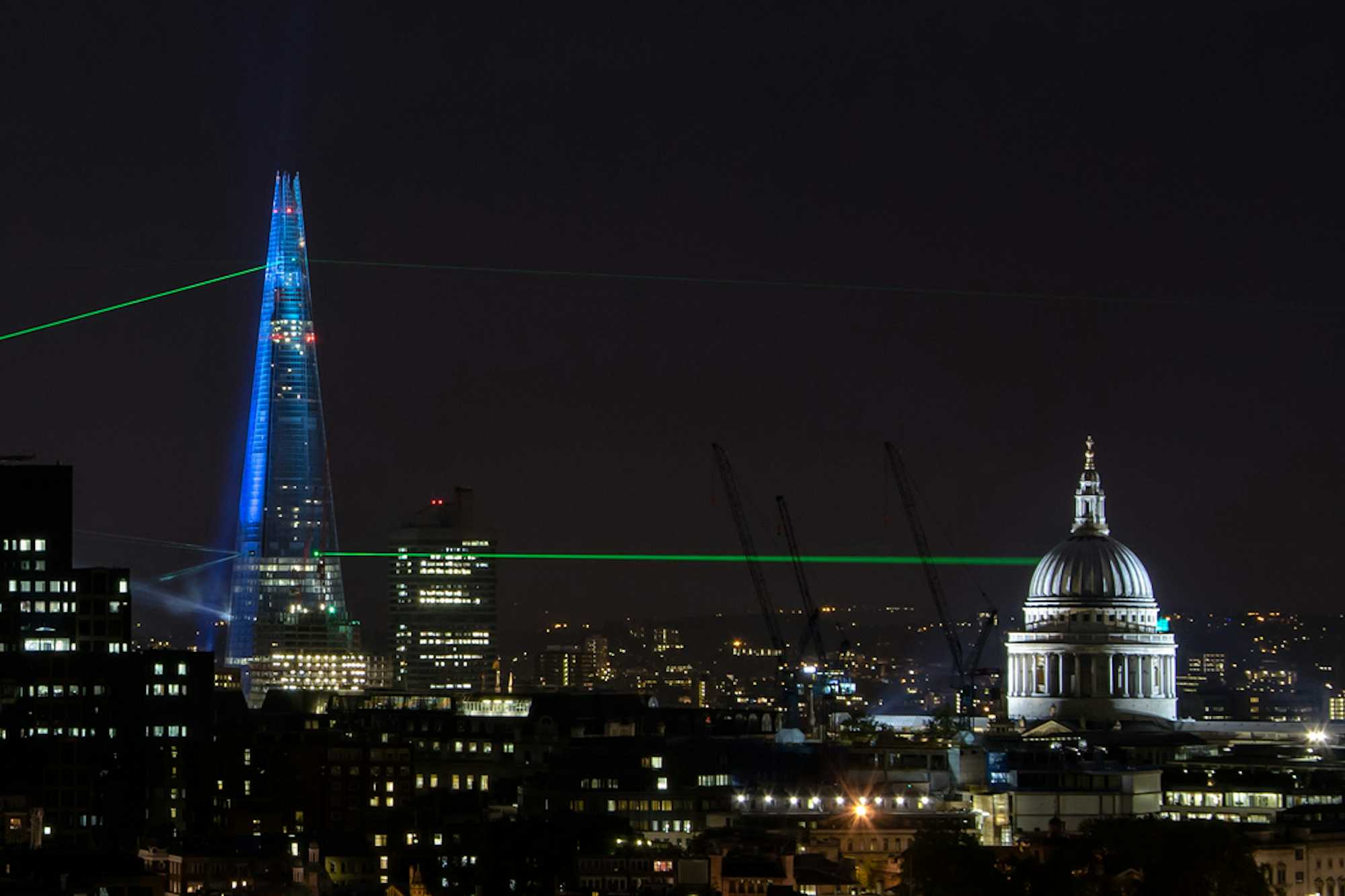 The Shard’s opening laser light show, a beam pointing to St. Paul’s